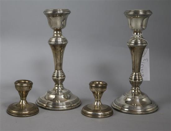 A pair of 1960s silver candlesticks and a pair of later dwarf candlesticks,